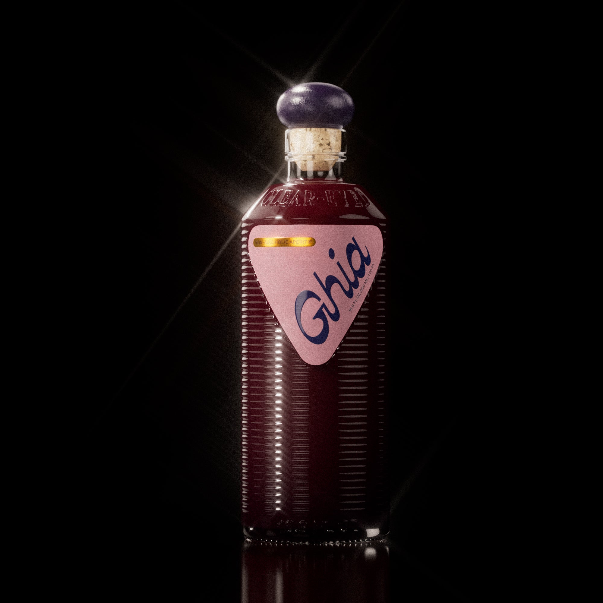 A Ghia non-alcoholic beverage in flavor Berry Apéritif clear bottle with ribbed glass, a purple cork top, and a pink label featuring bold branding on a reflective surface.