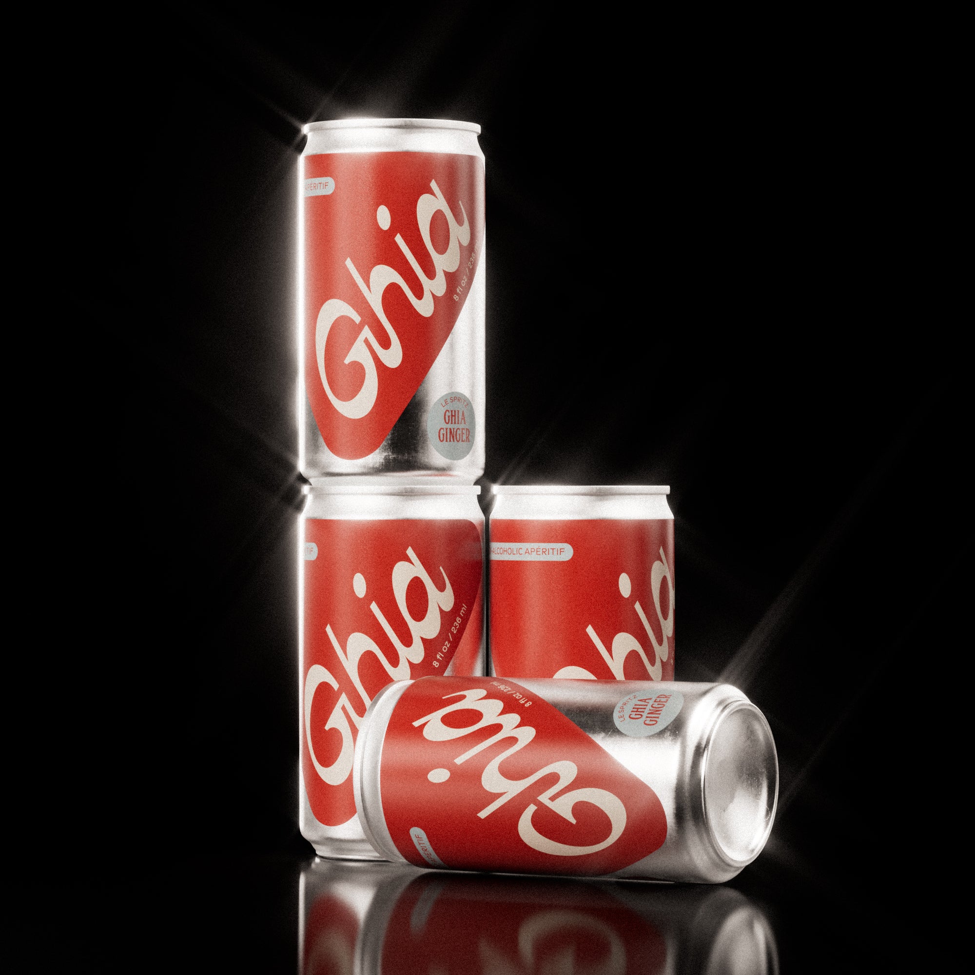 Four red Ghia non-alcoholic spritz cans with a red label, white lettering, and a silver aluminum body, arranged in a stylish stack on a glossy black surface, with bold white logo and silver accents.