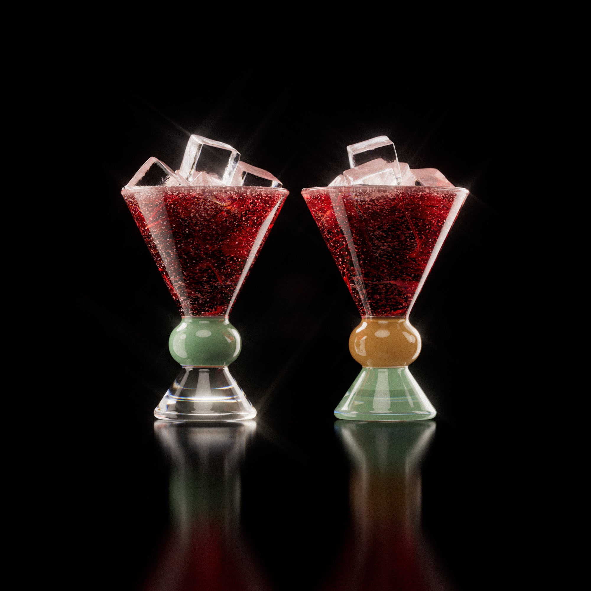 Two decorative glasses, each containing a red drink with ice cubes, highlighting the distinctive totem-inspired shape of the glasses against a light background with a clear, jade and sand base.