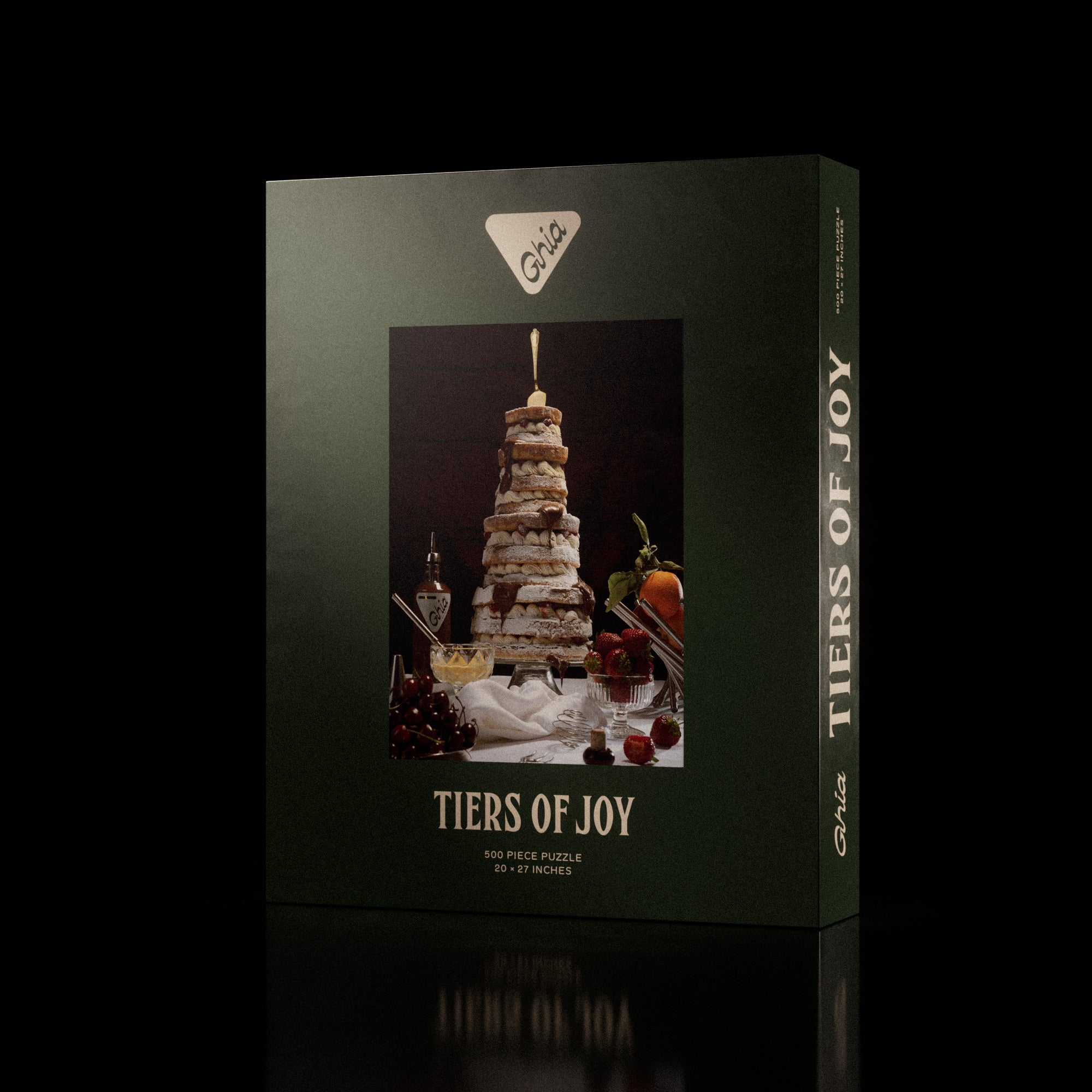 Ghia-branded 500-piece puzzle box featuring a whimsical illustration of a tall, layered dessert with candles and fruit.