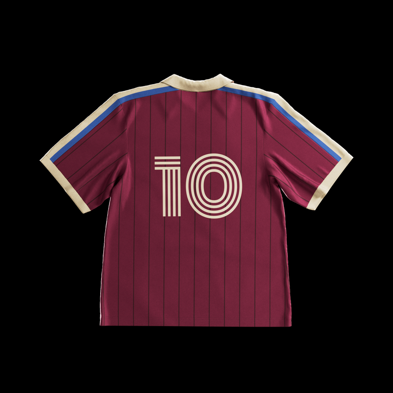 Back of maroon pinstriped Ghia jersey with cream number 10 and blue shoulder stripes