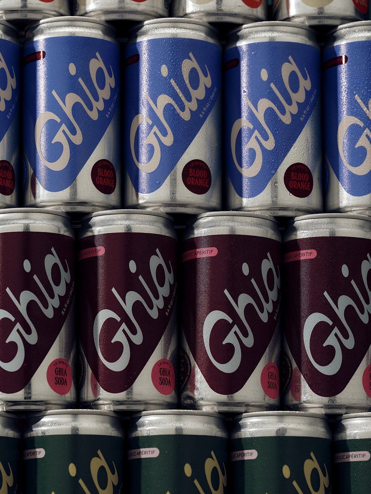 Stack of Ghia cans in various colors