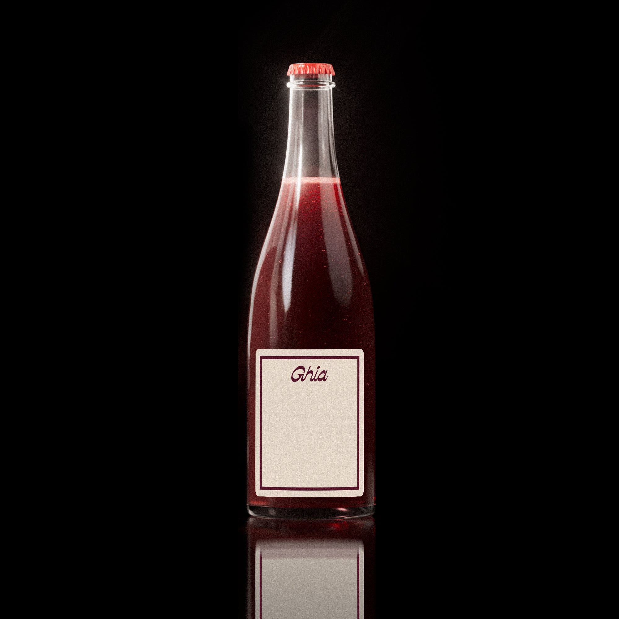 Single bottle of Ghia’s sparkling red non-alcoholic spritz with a minimalist cream label bordered in red and the Ghia logo centered at the top.