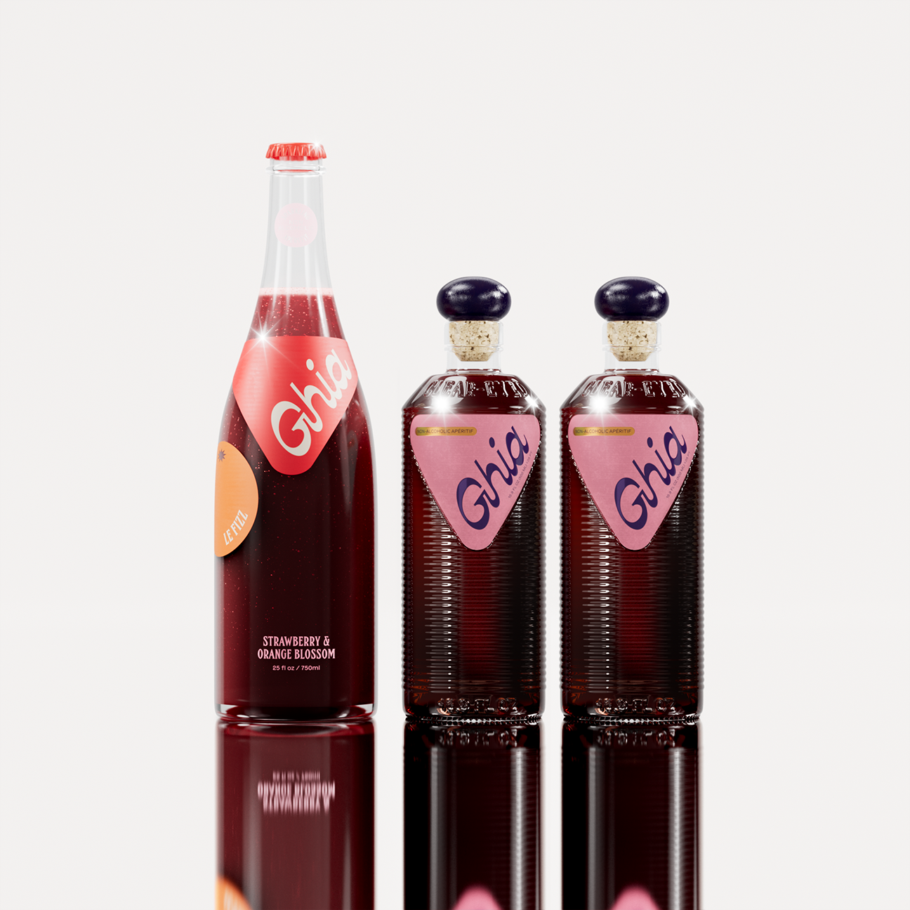 Ghia Bottle Bundle featuring a 750ml bottle of Le Fizz and two 500ml bottles of the Apéritif in Berry flavor, arranged on a reflective white background. A non-alcoholic beverage set designed for mindful drinking.