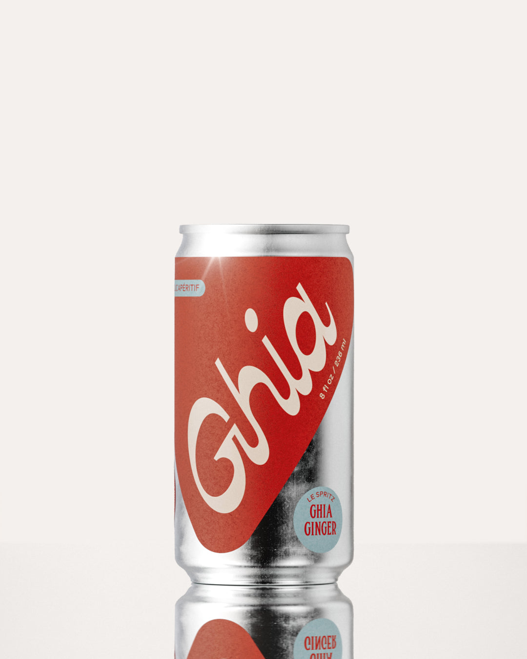 A Ghia non-alcoholic spritz can with a red label, white lettering, and a silver aluminum body, featuring a ginger-flavored non-alcoholic spritz beverage.