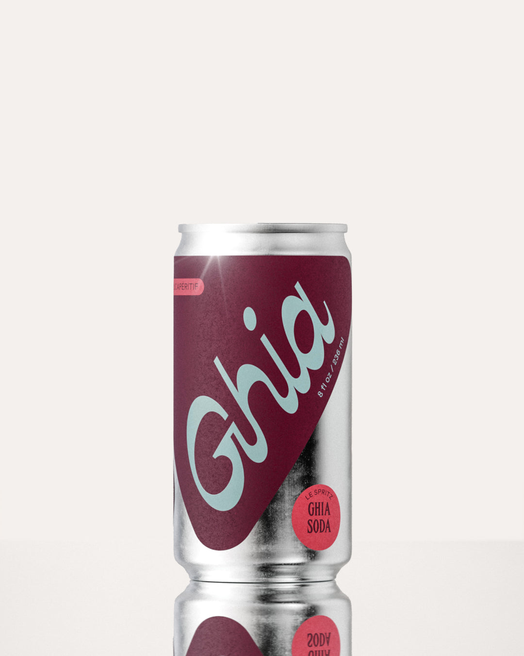 A Ghia non-alcoholic spritz can with a berry-colored label and bold branding on a silver aluminum body, featuring a non-alcoholic spritz beverage.