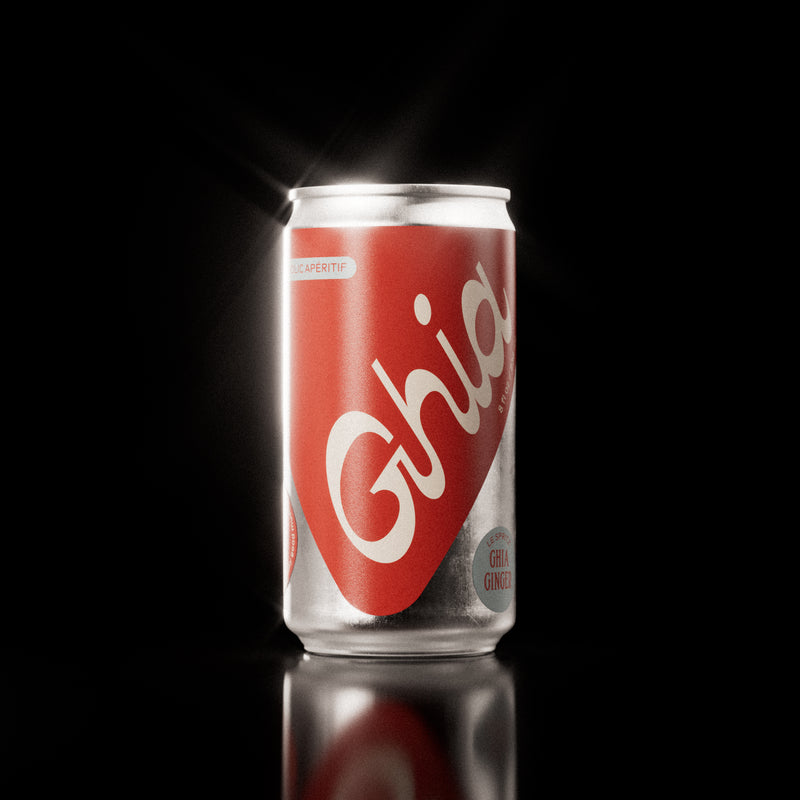 A Ghia non-alcoholic spritz can with a red label, white lettering, and a silver aluminum body, featuring a ginger-flavored non-alcoholic spritz beverage.
