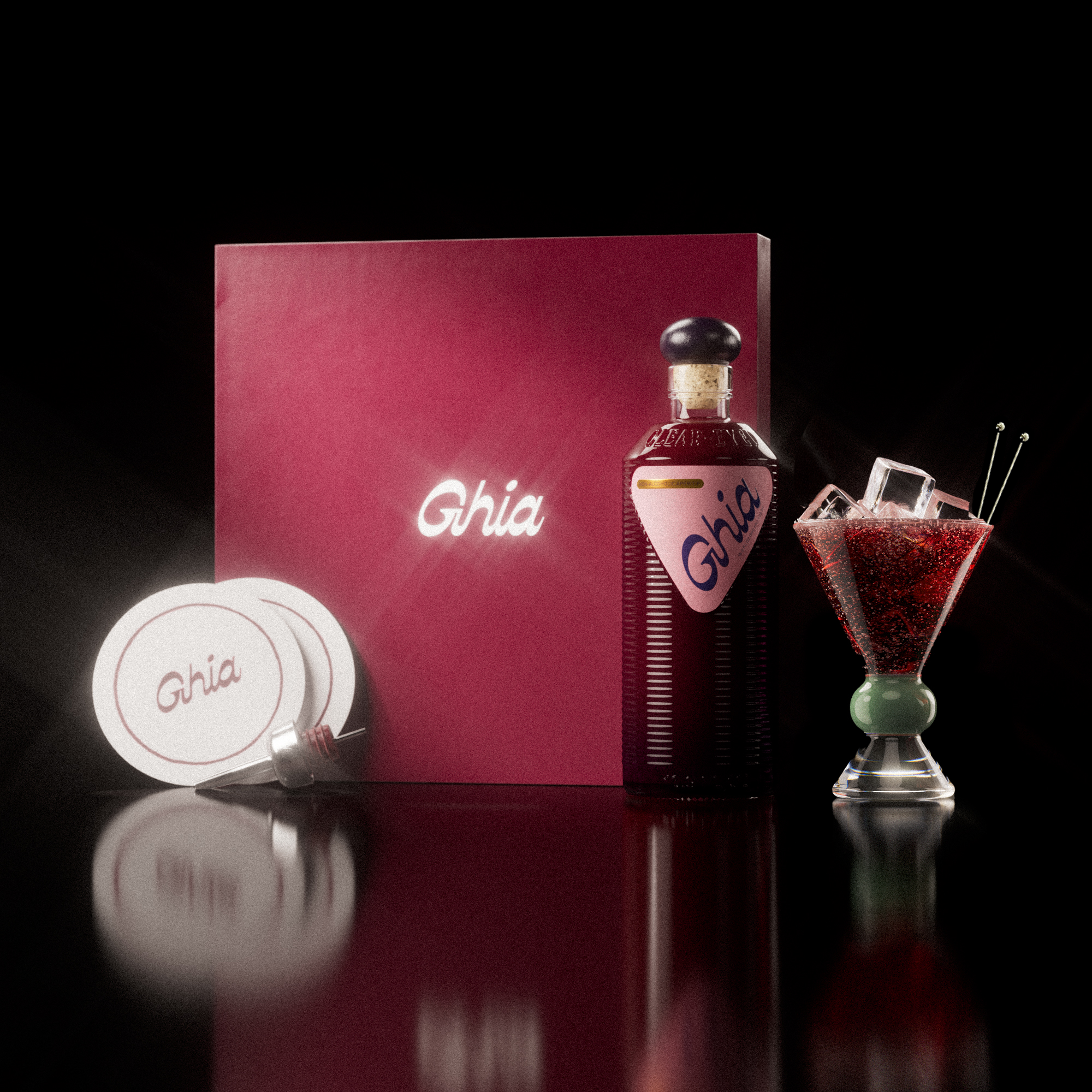 A Ghia non-alcoholic aperitif gift set with a burgundy box, paper coasters, 1 glass bottle of Berry Apéritif, and a decorative cocktail glass that has a jade and clear base.