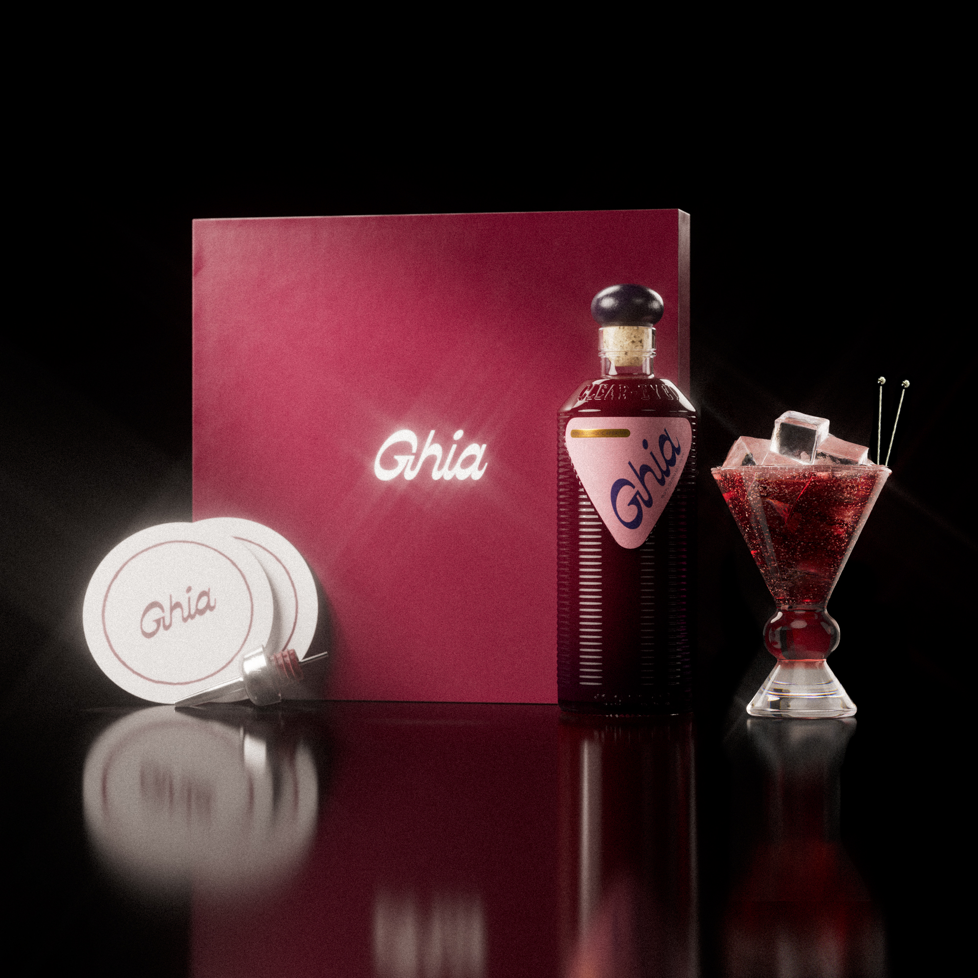 A Ghia non-alcoholic aperitif gift set with a burgundy box, paper coasters, 1 glass bottle of Berry Apéritif, and a decorative cocktail glass that has a amber and clear base.