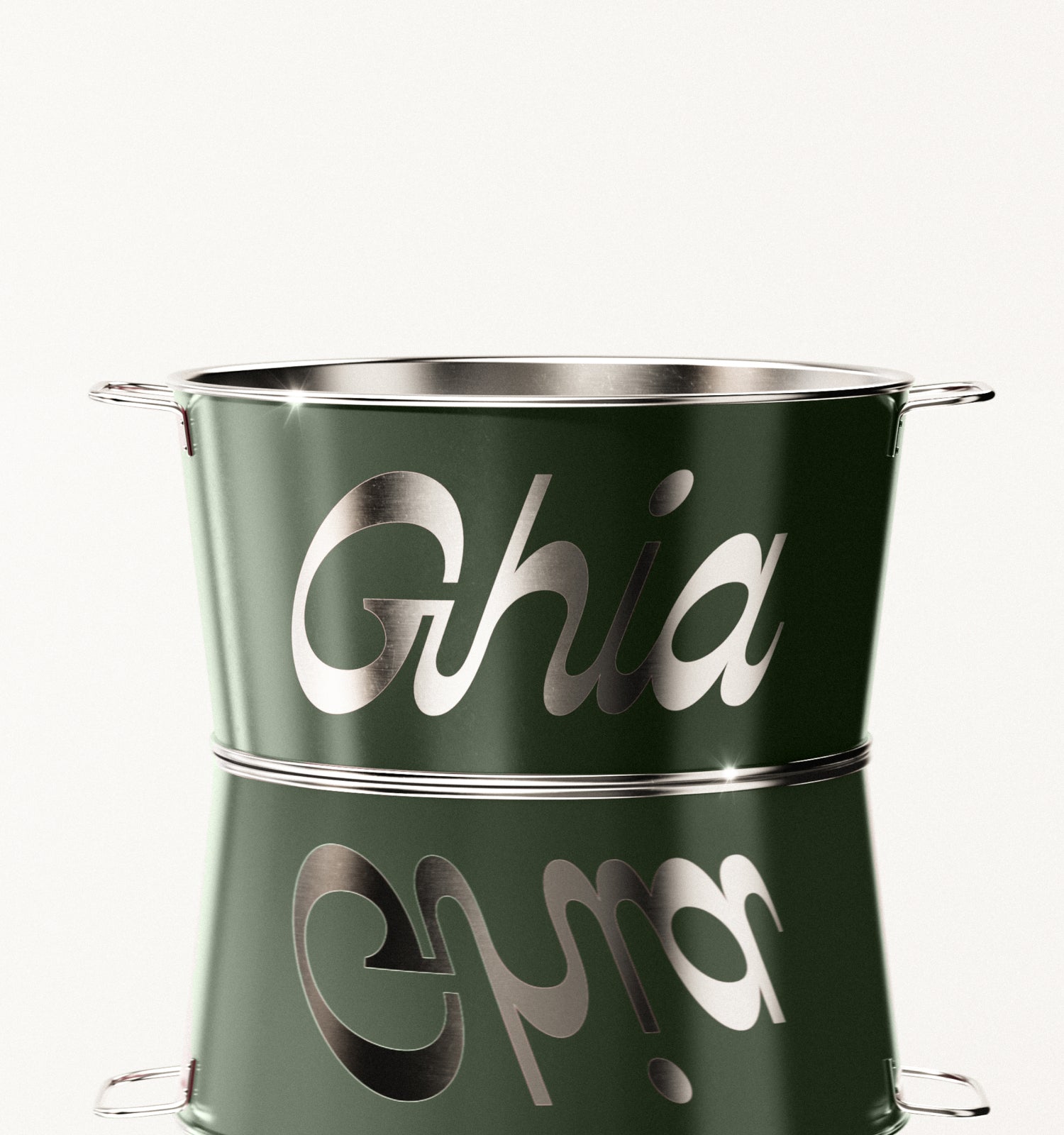 A green Ghia-branded metal ice bucket with silver lettering and handles on both sides, reflecting light on its polished surface.