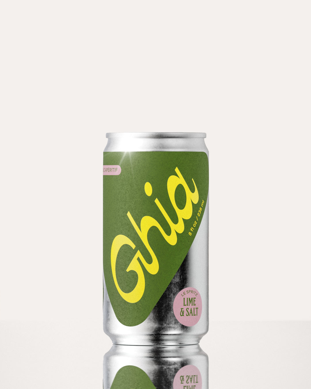 A Ghia non-alcoholic spritz can with a green label, yellow lettering, and a silver aluminum body, featuring a lime and salt flavored  featuring a non-alcoholic spritz beverage.