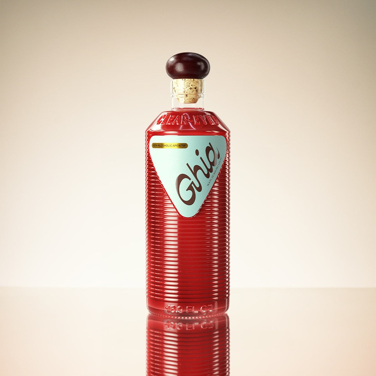 A Ghia non-alcoholic beverage in flavor Original Apéritif bottle with a deep red hue, ribbed glass design, a burgundy cork top, and a light blue label featuring bold branding.