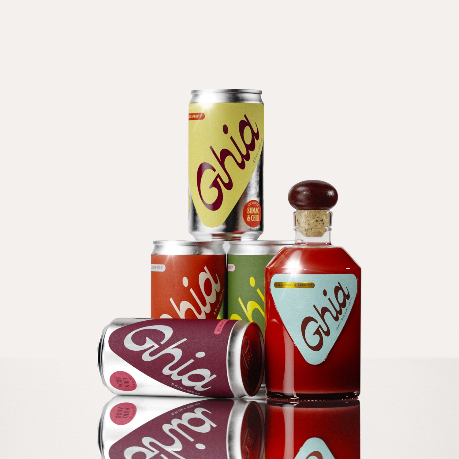 A mini glass bottle of non-alcoholic Original Apéritif with stacked non-alcoholic spritz cans in yellow, orange, green, and berry hues that represent the 4 flavors (Ghia-Soda, Ghia-Ginger, Lime & Salt, Sumac & Chili)